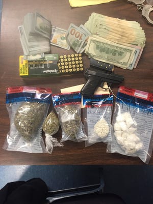 Police recovered suspected drug proceeds, pot, cocaine and a gun during a Rehoboth drug bust.