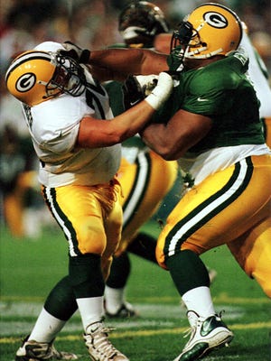 Craig Heimburger, left, played in two games for the Green Bay Packers as a rookie guard in 1999.