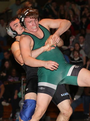 Elias Vega of Carteret, left, wrestles Chris Maszczak of South Plainfield at 170 lbs. in the GMC Wrestling Tournament finals at Piscataway High School on January 30, 2016.