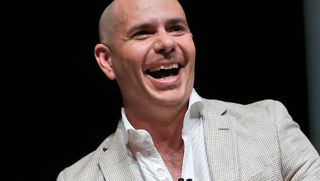 FILE - In this April 19, 2016 file photo, Pitbull appears at the eMerge Americas technology event in Miami Beach, Fla. Pitbull will be honored with a star on the Hollywood Walk of Fame on July 15.