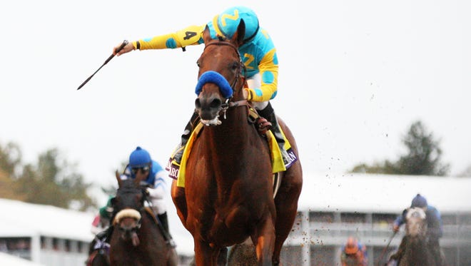Victor Espinoza, aboard American Pharoah wins the Breeders Cup Classic at Keeneland.October 31, 2015