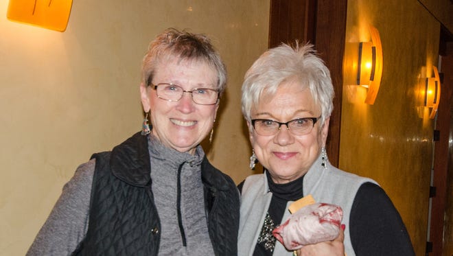 Lynne Wonacott, left, and Judy Salter attend the reception for “The Heart of Nuba” on Jan. 20 at the Cascade Theatre in Redding.