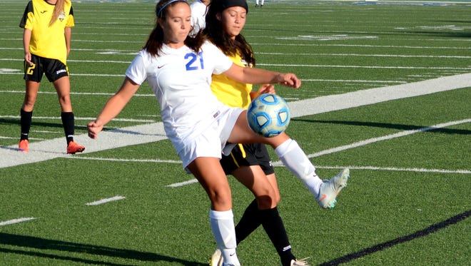 Carlsbad's Gabby Aragon keeps the ball in bounds in the first half Thursday against Alamogordo.