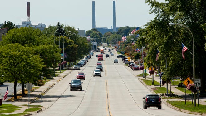 
Cars travel along Riverside Avenue in downtown St. Clair. 
