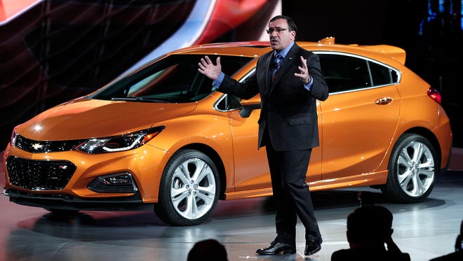 Alan Batey, president of General Motors North America, reveals the 2017 Chevrolet Cruze Hatchback  to the news media at the 2016 North American International Auto Show.