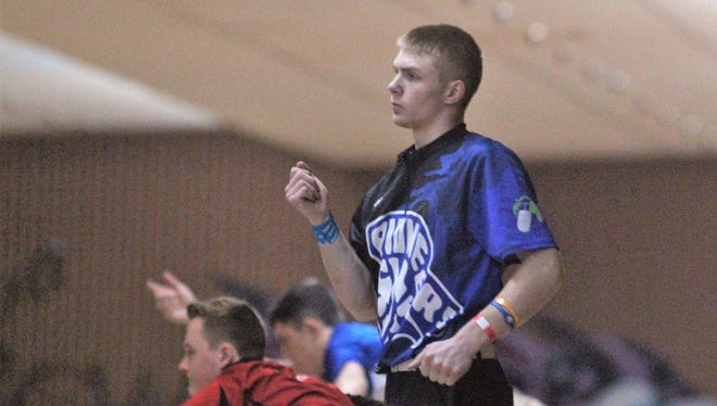 Jonathan Cummins of Simon Kenton reacts to his shot during the KHSAA state singles bowling tournament Feb. 8, 2018 at Executive Strikes & Spares, Louisville, KY.