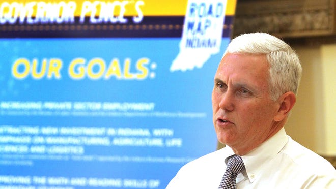 Indiana Gov. Mike Pence is shown announcing on Sept. 3, 2013, that the state has negotiated with the federal government on an extension of the Healthy Indiana Plan through 2014, to cover uninsured Hoosiers.