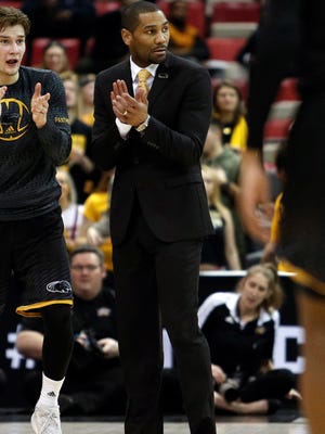 Milwaukee Panthers head coach LaVall Jordan claps against the Northern Kentucky Norse during the first half of the Horizon League Conference Tournament championship game at Joe Louis Arena on March 7.