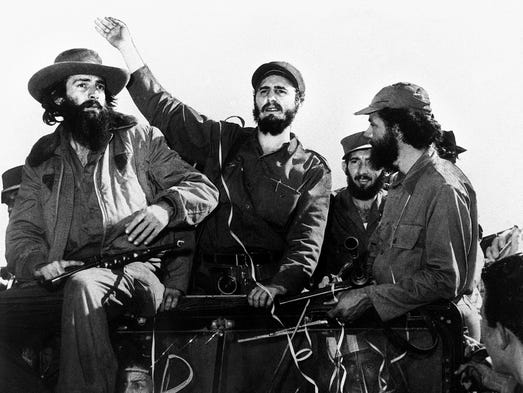 Cuban rebel leader Fidel Castro is surrounded by members