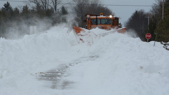 A plow in Ephraim works to clear a village street during the blizzard Saturday, April 14,2018.