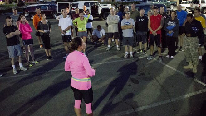 Participants get instructions before taking off in the 2013 5K run/walk to commemorate the victims of the IHOP shooting on Sept. 6, 2011, in Carson City. Tom R. Smedes/Special to the RGJTom R. Smedes/ Special to the RGJLora Boldry talks to Soldiers and Airmen of the Nevada Guard before an informal memorial run/walk to commemorate the victims of the International House of Pancakes shooting on Sept. 6, 2011.  Photos taken in Carson City on Friday morning, Sept. 6, 2013.