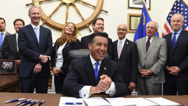 Gov. Brian Sandoval celebrated <137>on <137>Sept. 11 with leaders of the Nevada Legislature and his administration as he signed the bills that will provide incentives for Tesla’s gigafactory coming to Northern Nevada.