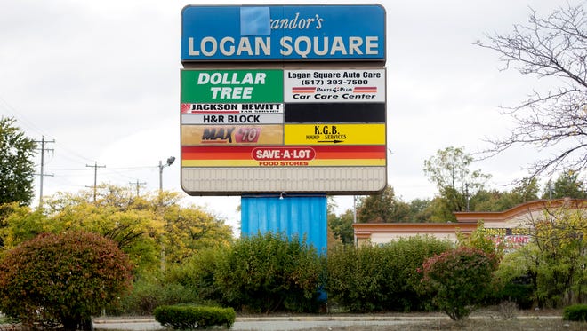 The Logan Square shopping center sign photographed on Thursday, Oct. 12, 2017, in Lansing. The property was bought by a real estate investment group from California in late 2018.