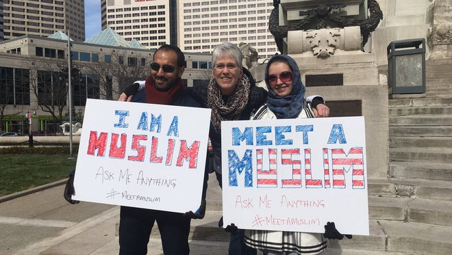 Deb Hutchinson (middle) poses during #MeetAMuslim day. The purpose of the day is to spread awareness of the religion and to encourage people to come learn about the religion.
