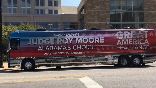 A bus sponsored by the Great America Alliance, a pro-Donald Trump PAC supporting former Alabama Chief Justice Roy Moore's U.S. Senate bid, is parked in downtown Montgomery, Ala. on September 21, 2017. The bus contained a misspelled URL that Democratic nominee Doug Jones' campaign quickly purchased.