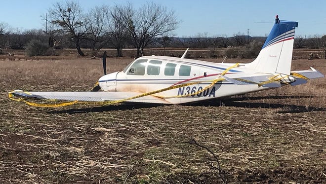 A single-engine plane rests on its belly in a field off County Road 311 southwest of Dyess Air Force Base on Monday, Jan. 22, 2018.