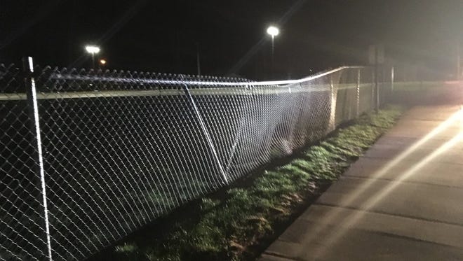 A fence is damaged Thursday night after being hit by a suspected drunken driver.