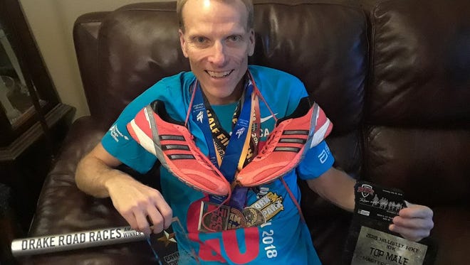 My top awards from 2018 along with the shoes I ran in at the Chicago Marathon.