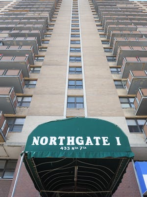 A woman is accused of throwing her ex's dog to its death from the 17th floor of the Northgate 1 high-rise in Camden.
