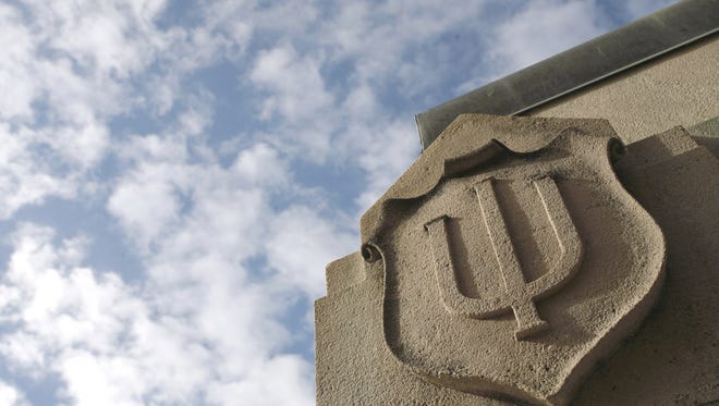 Indiana University logo carved in limestone.