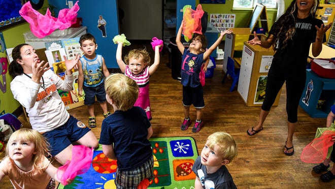 Children  participate in an activity with Stretch and Grow at Young People's Learning Center, Wednesday, June 10, 2015.