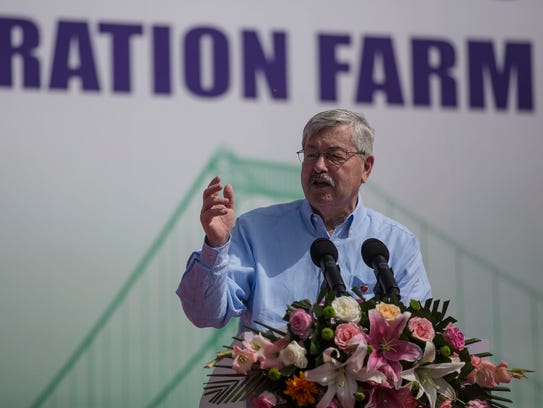 Ambassador Terry Branstad gives a speech during the