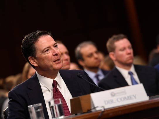 Former FBI Director James Comey testifies in front