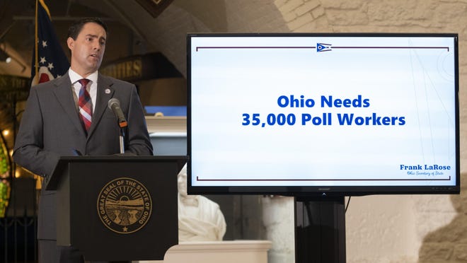 A video screen gives a plea for additional poll workers as Ohio Secretary of State Frank LaRose delivers an update on absentee voting and election security during a press conference in the Ohio Statehouse on Wednesday.