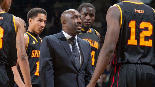 Grambling coach Shawn Walker, center, hopes to turn the Tigers’ program around with an influx of fresh talent next year.