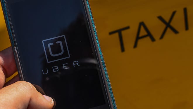 Taxi app Uber is official in Delaware after company and state officials came to an agreement on guidelines regulating the private car service.