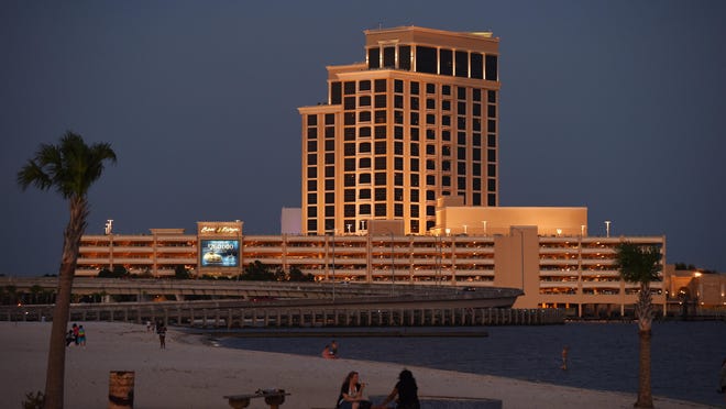 The Beau Rivage Casino and Resort glows at dusk in Biloxi.