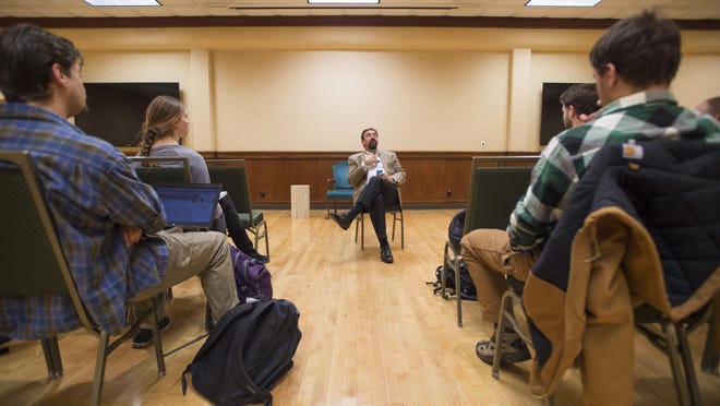 Colorado State University students listen as Chancellor and President Tony Frank addresses a question during an open forum at the Lory Student Center in Fort Collins on Jan. 29.