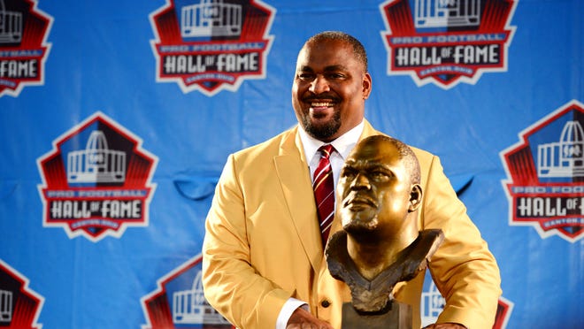 Aug 2, 2014; Canton, OH, USA; Seattle Seahawks former tackle Walter Jones poses with his Bust during the 2014 Pro Football Hall of Fame Enshrinement at Fawcett Stadium. Mandatory Credit: Andrew Weber-USA TODAY Sports