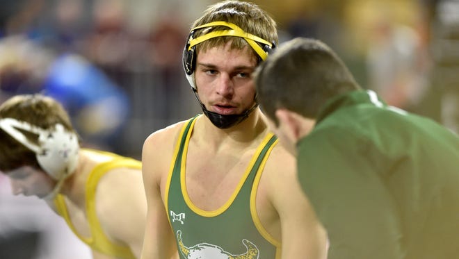 CMR's Kai Stewart talks with his coach Aaron Jensen during his quarterfinal match during the first day of the all-class state wrestling tournament at MetraPark in Billings, Friday, Feb. 9, 2018.