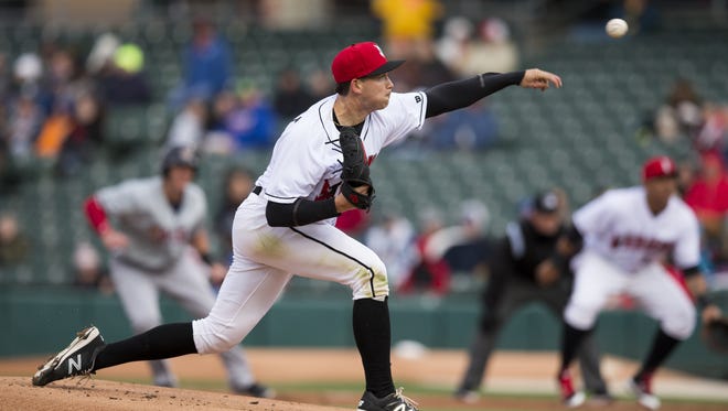 Opening day starter Steven Brault throws with a runner on base during the first Indianapolis Indians game of the season, vs. the Toledo Mud Hens, Victory Field, Indianapolis, Thursday, April 6, 2017.