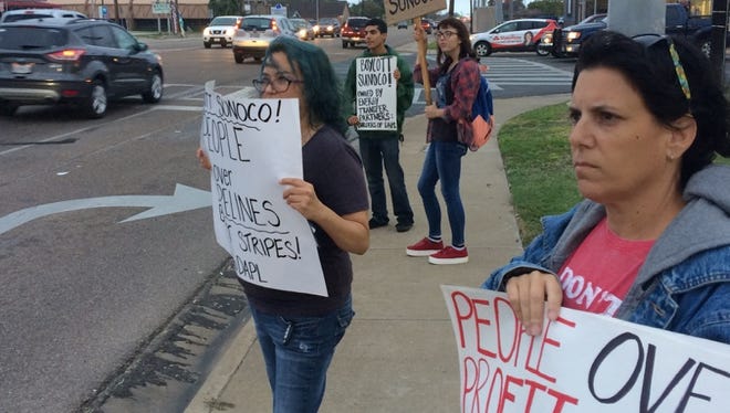 About a half-dozen protesters held signs in front of a Sunoco gas station Friday afternoon at Saratoga Boulevard and Holly Road. The group was protesting the Dakota Access oil pipeline in North Dakota near the Standing Rock Sioux reservation, saying the pipeline would cross tribal lands including burial grounds and threaten the environment. Hundreds of protesters are camping out near the site in rural North Dakota. The pipeline builder, Dakota Access, LLC, is a subsidiary of Dallas-based Energy Transfer Partners, L.P., the parent company of Sunoco. Energy Transfer Partners says the pipeline would boost local economies and create jobs.
Stripes convenience stores came under Sunoco management when Energy Transfer Partners bought Corpus Christi-based Susser Holdings Corp. in 2014.