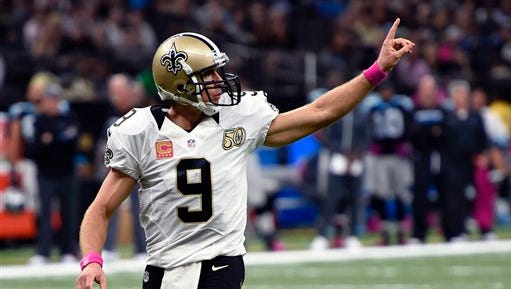 New Orleans Saints quarterback Drew Brees (9) reacts after a pass completion in the first half of an NFL football game against the Carolina Panthers in New Orleans, Sunday, Oct. 16, 2016. (AP Photo/Bill Feig)