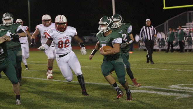 Port Clinton senior Russell DeMarco (No. 82) attacks life and ball-carriers with a similar drive.
