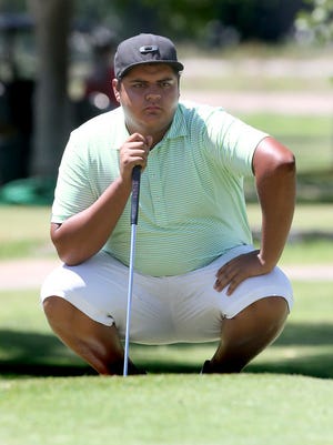 Mike Soto studies a putt during the championship round of the 70th annual Anthony Invitational at the Anthony Country Club in New Mexico.
