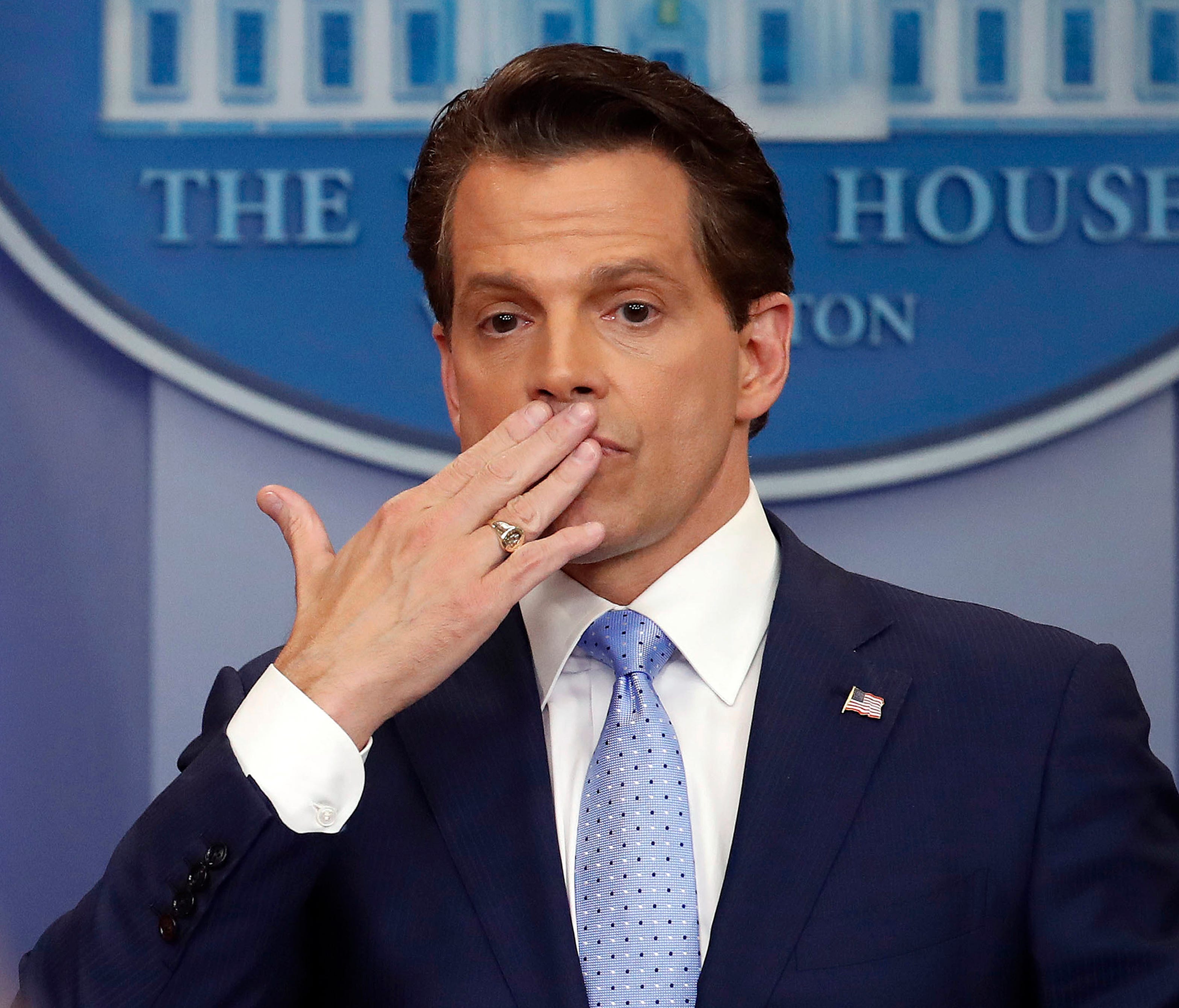 In this July 21, 2017 photo, incoming White House communications director Anthony Scaramucci, right, blowing a kiss after answering questions during the press briefing in the Brady Press Briefing room of the White House in Washington.