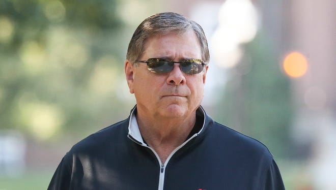University of Louisville Athletic Director Tom Jurich arrives at Grawemeyer Hall to meet with interim president Greg Postel on Wednesday morning.