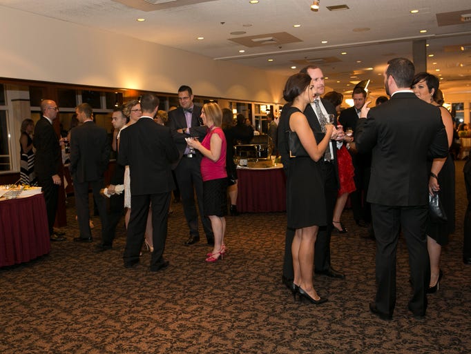 Guests mingle during the third annual Bow Tie Ball