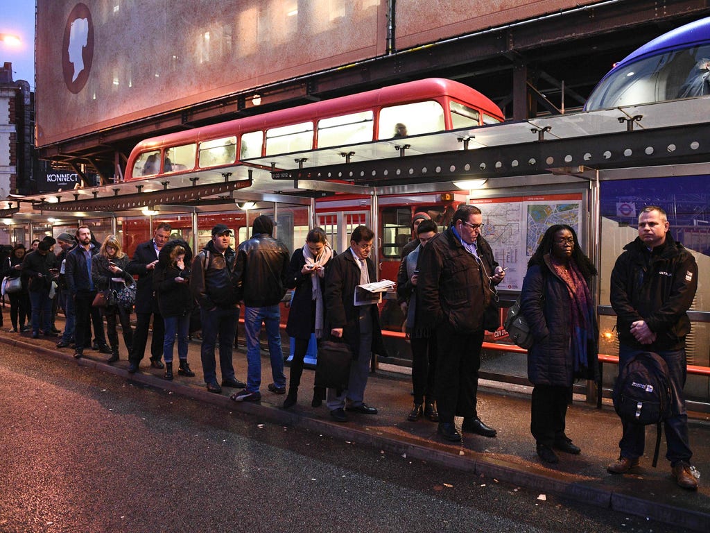 Commuters queue at Victoria bus station in central London on Jan. 9, 2017, during a 24-hour tube strike. A strike on the London Underground caused major disruption Jan. 9, as almost all stations in the city center shut and services were cancelled in 