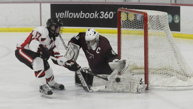 Clifton's goalie Tyler Gibson (42) blocks a shot from Lakeland's Andrew Heck (17) during Monday's Passaic County ice hockey final. Both are among the the North Jersey leaders at their positions.
