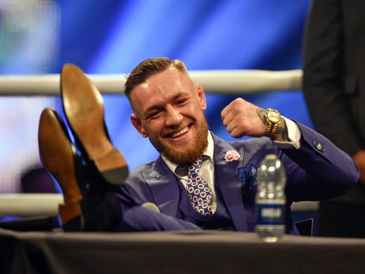 Conor McGregor reacts during a world tour press conference