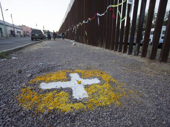 A cross marks the site near where Jose Antonio Elena-Rodriguez
