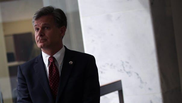 Wray waits in a hallway prior to his meeting with Sen.