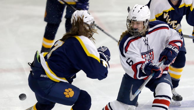 Fox Cities Stars Lauryn Hull (6) battles for control of the puck against University School of Milwaukee's Michaela Fritz (7) during their girls' hockey game Thursday, January 28, 2016, at Tri-County Ice Arena in the Town of Menasha, Wisconsin. Dan Powers/USA TODAY NETWORK-Wisconsin