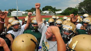 Melbourne Central Catholic coach Rich Pruzinsky fires up the players during practice for the first time in full pads held Thursday night at the MCC football field in Melbourne .