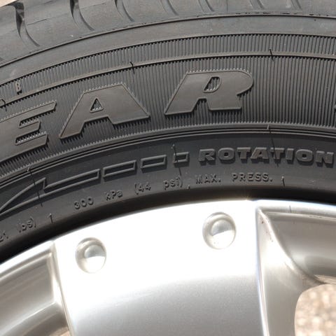 A close-up of a Goodyear tire, with inflation spec